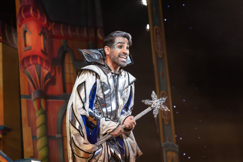 Dr. Ranj in a sparkling costume as the Man in the Mirror in Snow White Churchill Theatre 2024