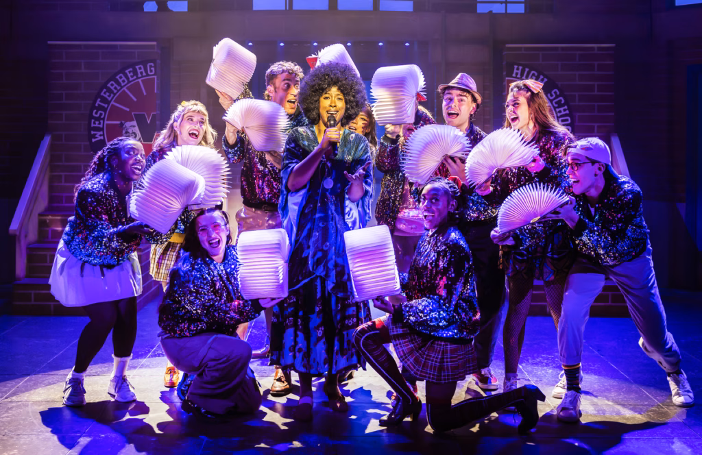 Cast of Heathers The Musical performing together on stage