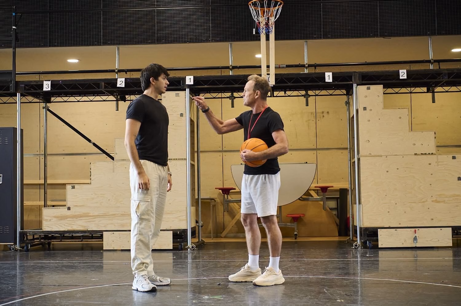 Cast rehearsing a basketball court scene for Disney’s High School Musical.