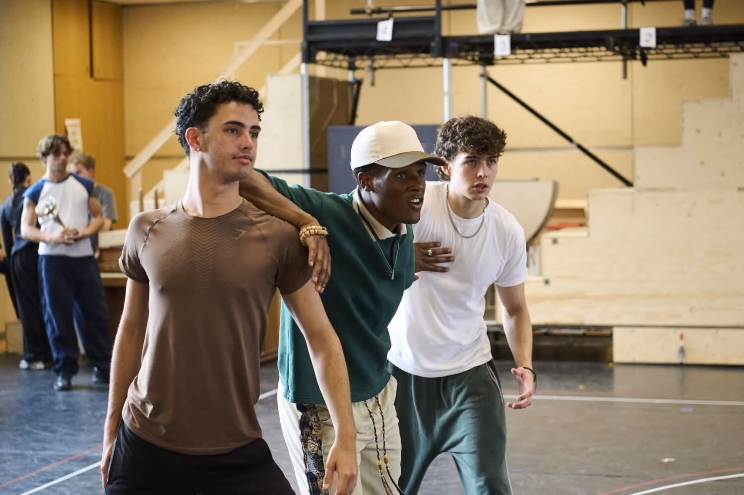 High School Musical cast members rehearsing together in the rehearsal room.