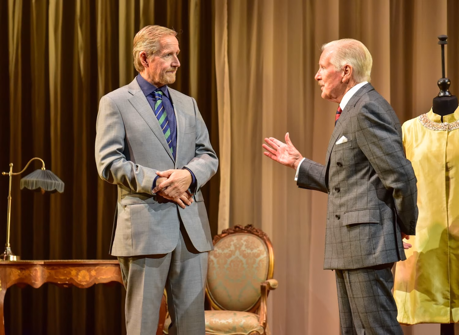 Two performers in conversation in By Royal Appointment on its 2026–27 UK tour