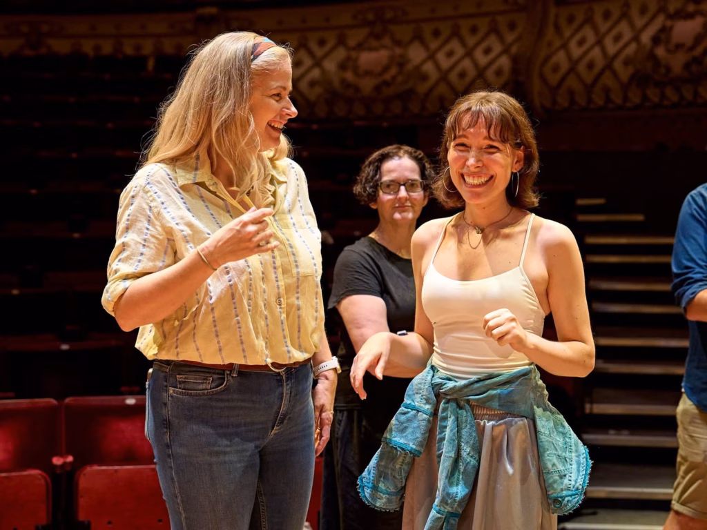 Martin Guerre company in rehearsal with wooden props