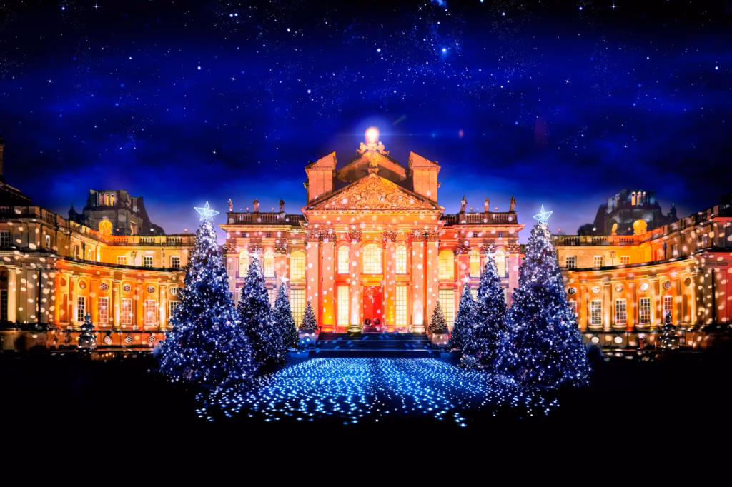 Illuminated Christmas trees and festive light projections at a Christmas light trail