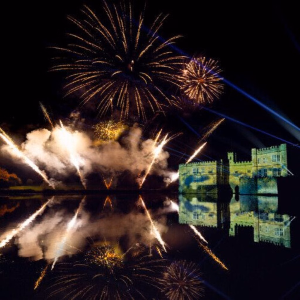Fireworks and laser effects over Leeds Castle reflected in the water