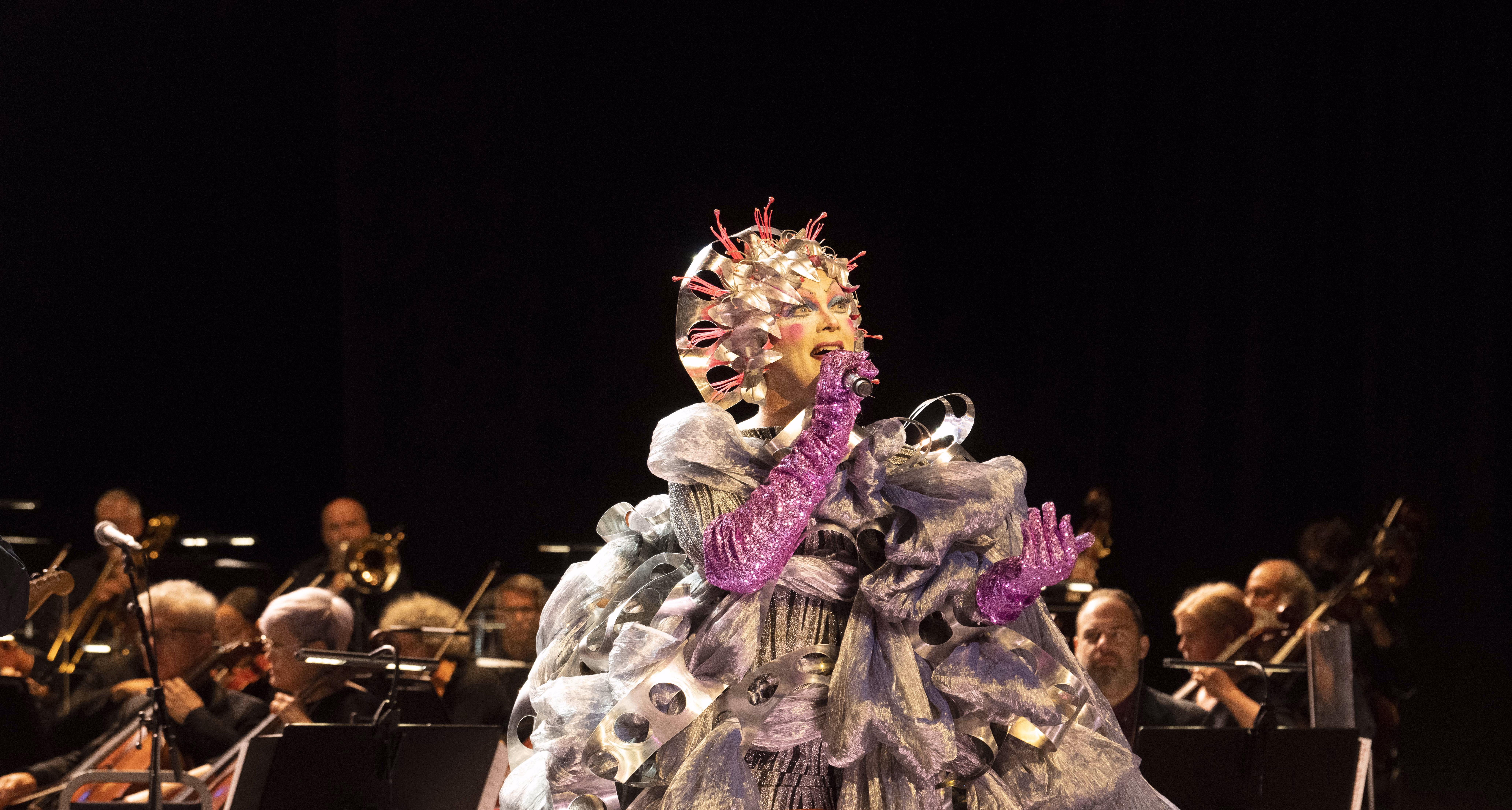 Taylor Mac performing in an elaborate costume
